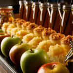 Extreme close up of apples cakes apple juice and sweetie jars a plate as part of mercure hotels meeting food offering