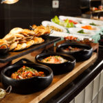 Bowls of curry, rice and naan bread at meetings buffet