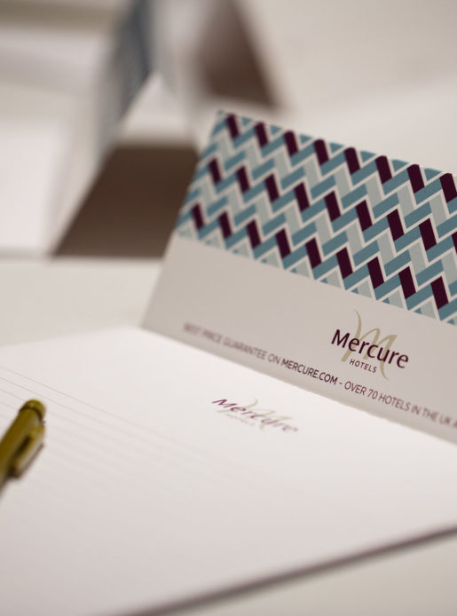 Mercure-branded notepaper set up ready for a meeting at a Mercure Hotel