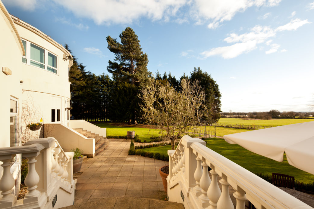 Exterior shot of the gardens at Mercure Chester Abbots Well Hotel