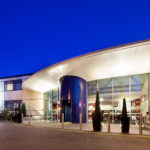Exterior shot of Mercure Chester Abbots Well Hotel at night