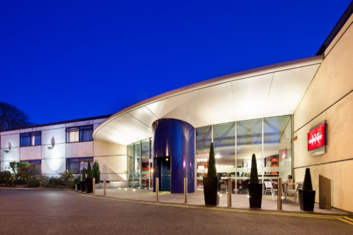 Exterior shot of Mercure Chester Abbots Well Hotel at night