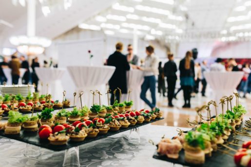 People at an event with food catering