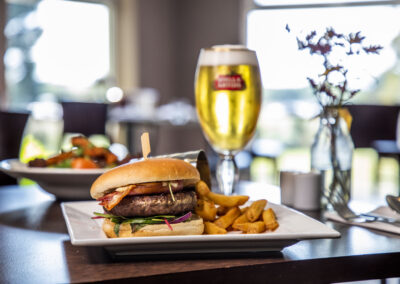 Burger and a pint of beer on the table