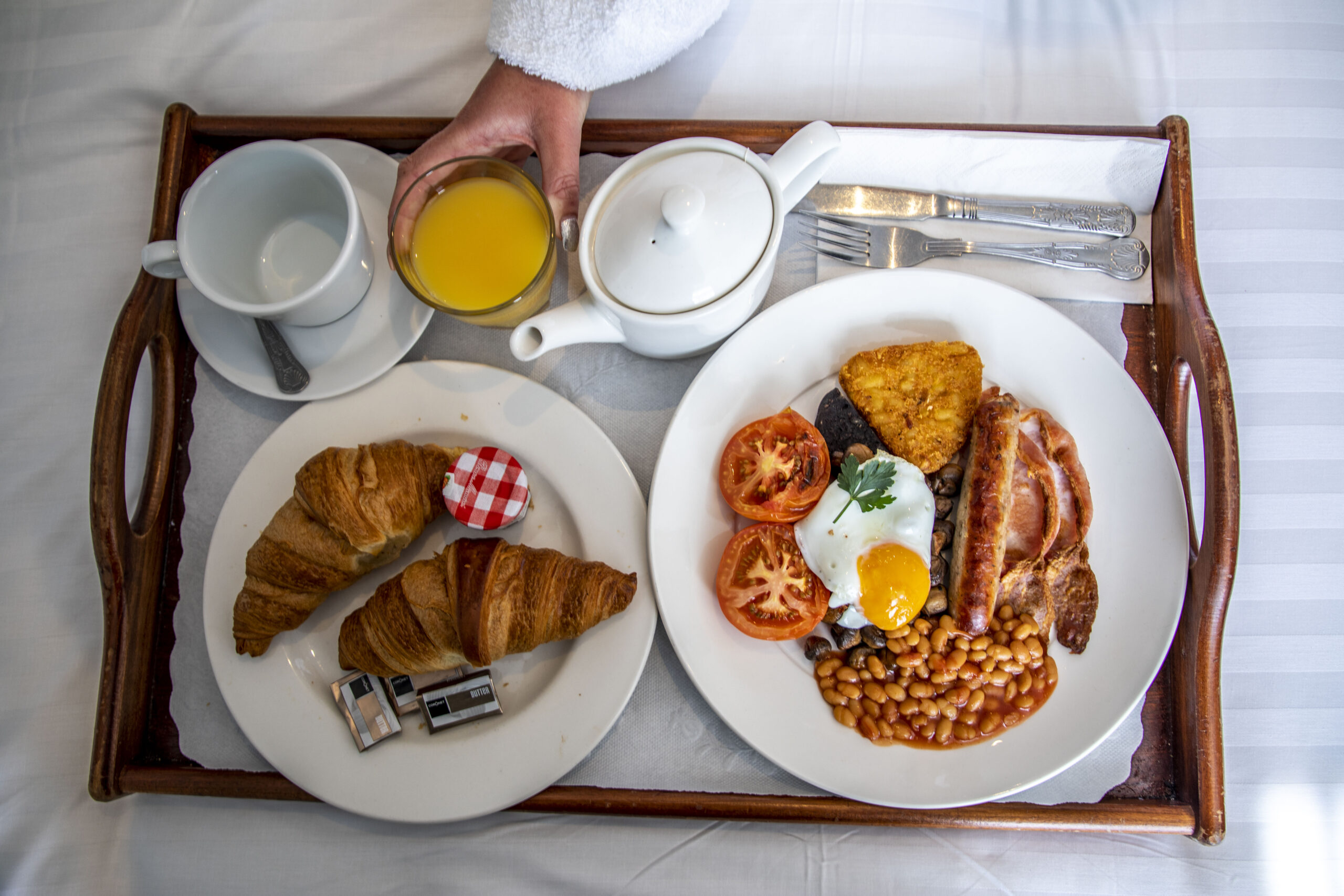 A tray of breakfast on bed