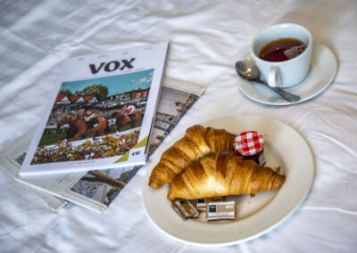 Pastry with magazine on bed