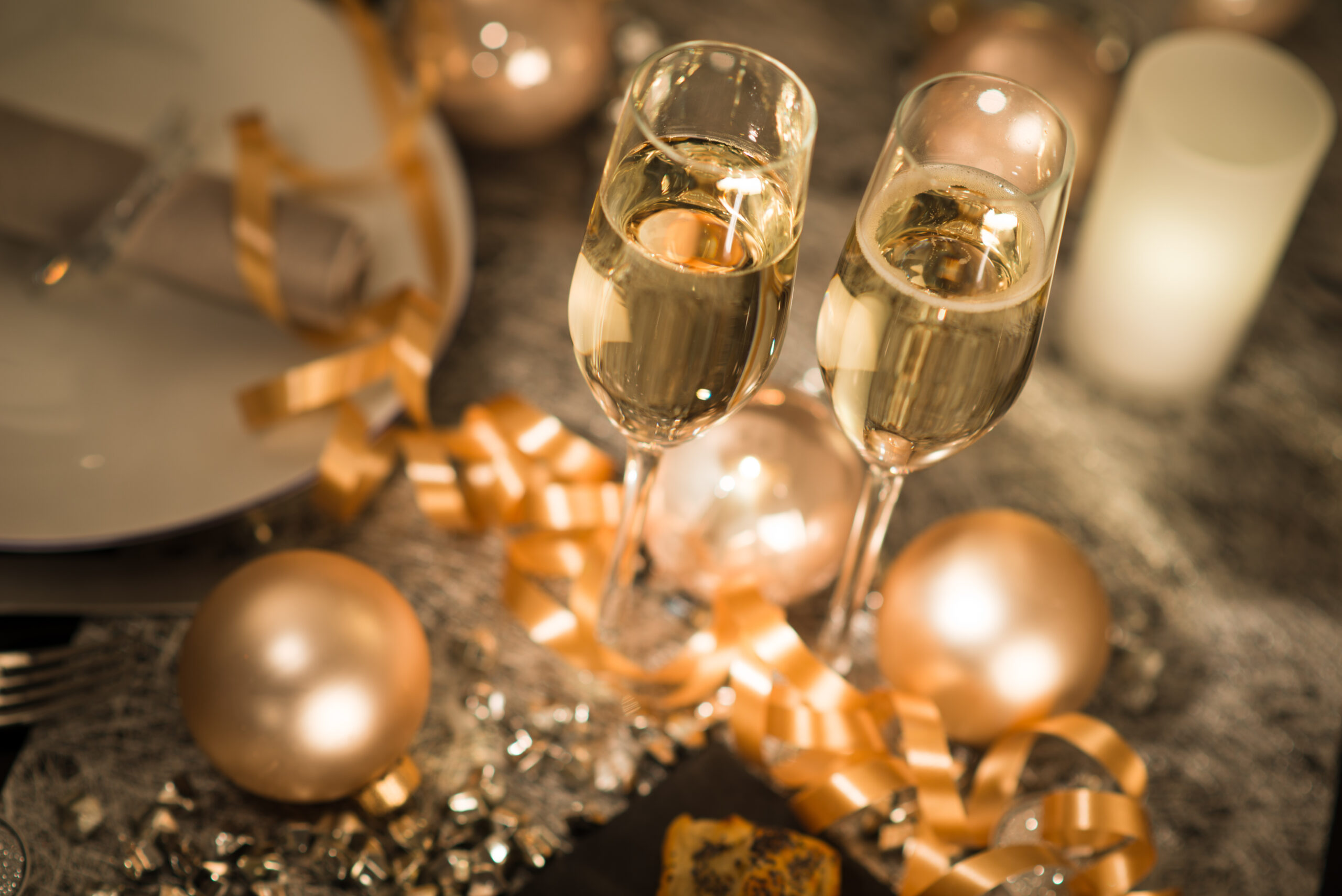 New,Years,Eve,Party,Table,With,Champagne,Flute,Ribbon,And people together celebrating